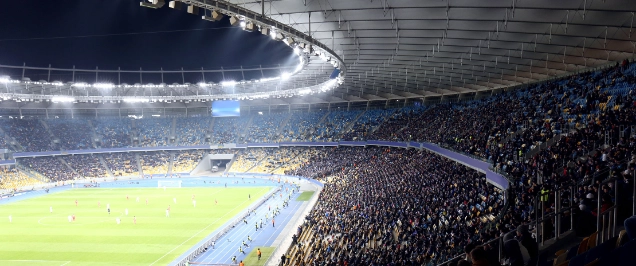Panoramic view of modern stadium during football match